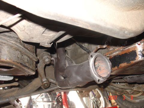 1973 Ford Ranchero - Underneath view of custom exhaust headers installed on a vehicle's engine.