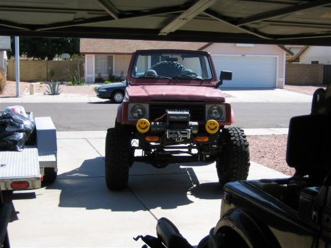 1987 Suzuki Samurai - This Suzuki Samurai is equipped with off-road tires and a front-mounted winch.