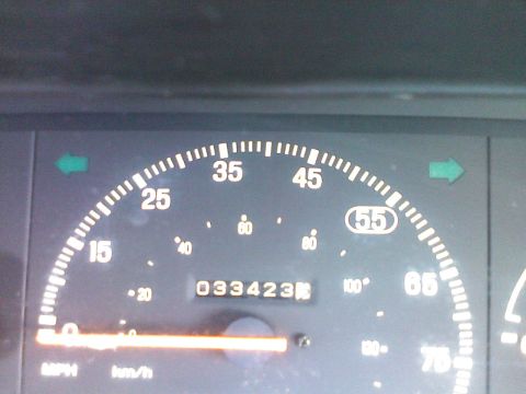 1991 Ford Festiva - Vehicle's dashboard shows speedometer and odometer with 33,423 miles.