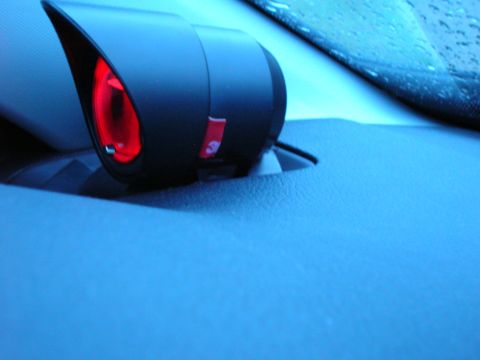 1994 Ford Probe - Close-up of an interior car component with a red illuminated lens and a small red label visible.
