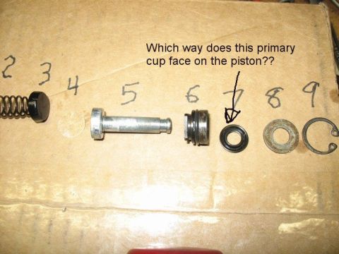 1985 Ford LTD Crown Victoria - Various brake master cylinder components are displayed and numbered, with an arrow pointing to a seal and a question about its placement.