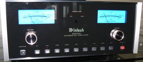2006 Ford E350 - Front view of a McIntosh MA6300 integrated amplifier, two illuminated power output meters and various input selection buttons.