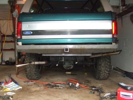 1996 Ford Bronco - The rear of a 1996 Ford Bronco is shown with a custom bumper and exhaust system installed.