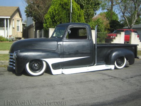 1968 Ford Mustang - Customized pickup truck with a matte black finish and white racing stripes.
