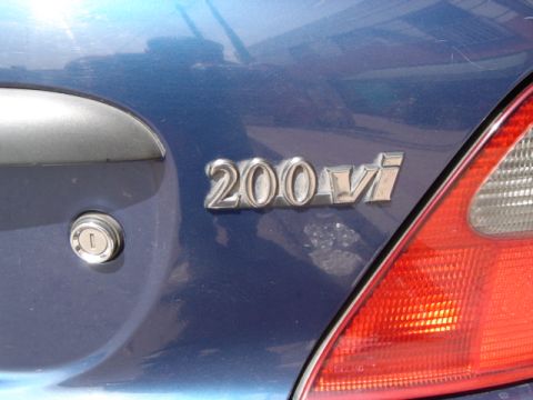 1998 Land Rover Land Rover - Close-up of a '200 vi' emblem on the rear of a blue vehicle.