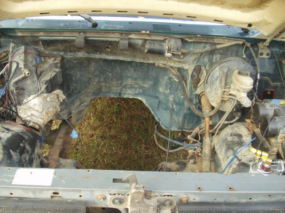 Engine bay of a vehicle with the engine removed