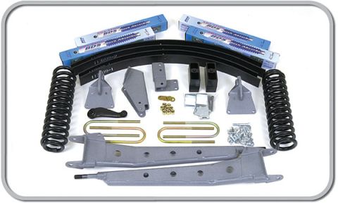 1996 Ford Bronco - A collection of suspension components, including springs and brackets, are laid out for a vehicle.