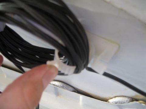1996 Ford Bronco - Two of these wire holders are what the wire is wrapped around. the top one was cut in half and this is the bottom one that latches.