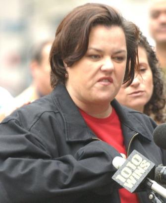 1991 Ford Bronco - Rosie O'Donnell speaks at a press event, with a microphone visible.