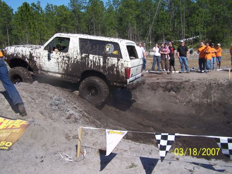 1989 Ford Bronco - A white 1989 Ford Bronco navigates a muddy obstacle course during an event in 2007.