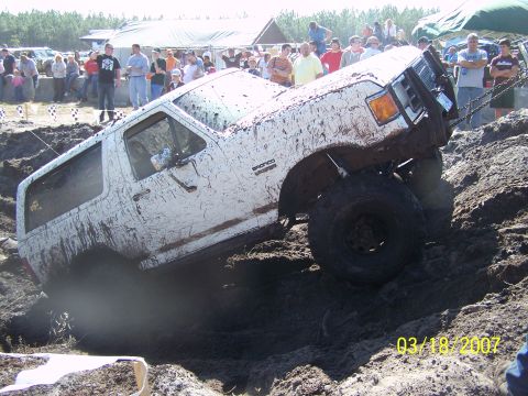 1989 Ford Bronco - A white Ford Bronco navigates a muddy obstacle course during an event on March 18, 2007.