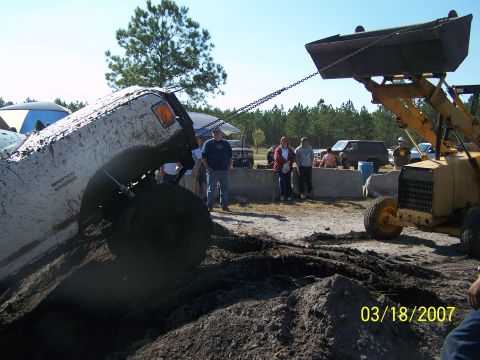 1989 Ford Bronco - A muddy 1989 Ford Bronco is pulled by a loader during an event on March 18, 2007.