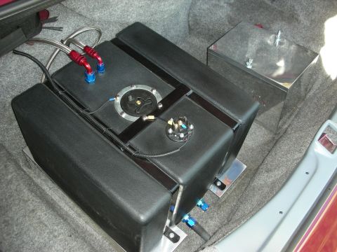 1992 Ford Crown Victoria - Aftermarket fuel tank and fuel cell installed in car trunk with braided fuel lines.