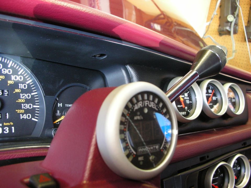 Dashboard of a 1992 Ford Crown Victoria with an air/fuel gauge, boost gauge, and temperature gauge