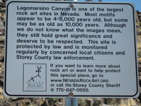 1997 Chevrolet C/K Pickup - A sign provides information about the historical significance and protection of rock art sites in Lagomarsino Canyon, Nevada.