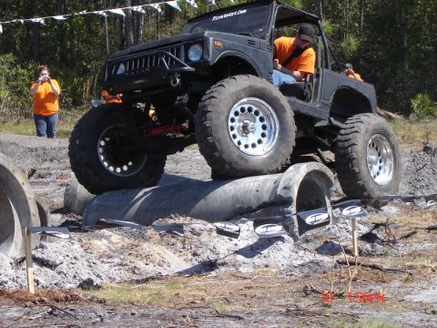 1989 Ford Bronco - This heavily modified off-road vehicle navigates a challenging obstacle course.