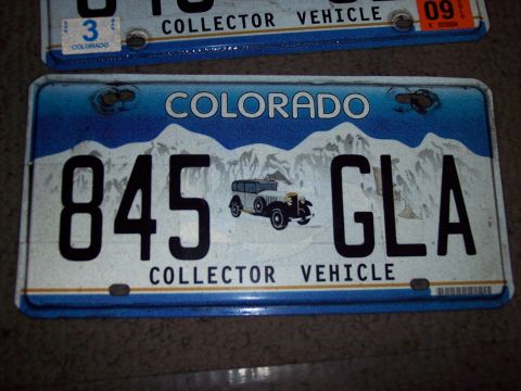 1972 Ford Ranchero - Two Colorado license plates are visible, one above the other, with the lower plate a graphic of a vintage automobile.