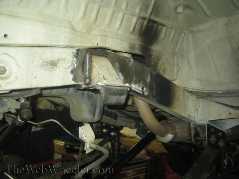 1987 Suzuki Samurai - Vehicle frame modifications with visible welds, likely for suspension upgrades.