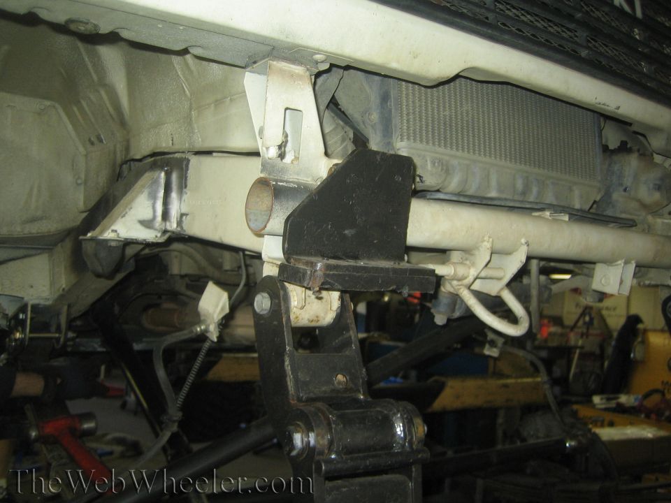 Vehicle frame with custom suspension mounts and a radiator visible