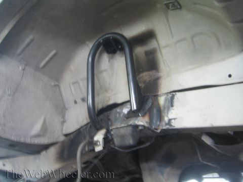 1987 Suzuki Samurai - Close-up of a custom shock mount being fabricated and welded onto the vehicle's frame.