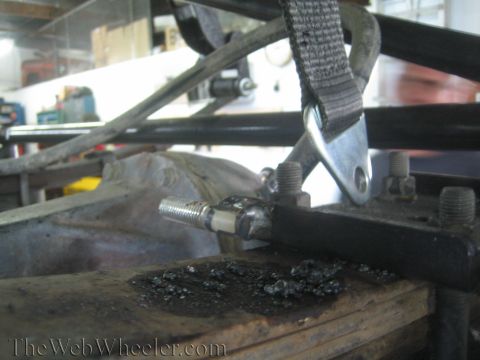 1987 Suzuki Samurai - Detail of a vehicle's suspension component, possibly during modification or after modification.