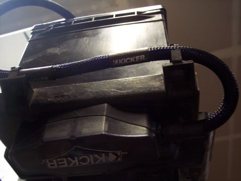 1995 Ford Probe - Close-up of a Kicker car audio amplifier and its wiring.