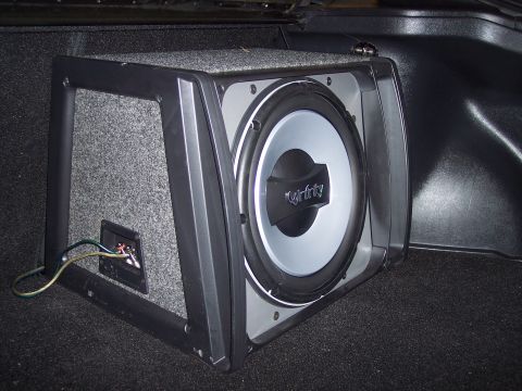 1995 Ford Probe - A car subwoofer is visible in the trunk of a vehicle.