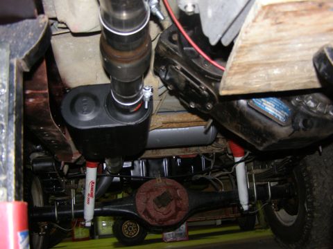 1993 Ford Bronco - This photo shows the undercarriage of a vehicle, focusing on the exhaust system and suspension components.