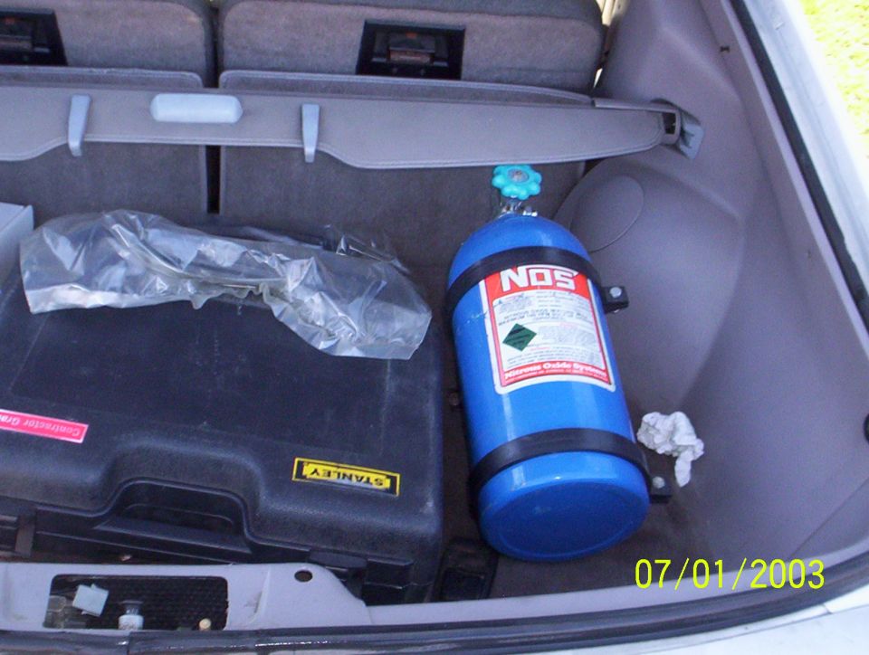 Trunk interior with blue NOS tank and black Stanley tool case. Date stamp 07/01/2003