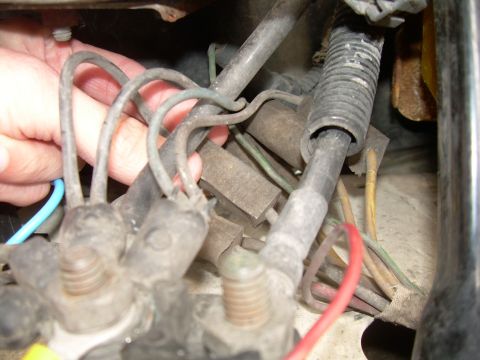 1988 Ford Bronco - A close-up view of a vehicle's electrical wiring harness, showing multiple wires and connectors.