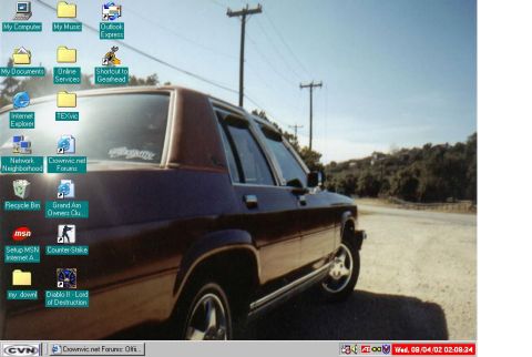 1986 Ford Crown Victoria LTD - A 1986 Ford Crown Victoria LTD is seen from the 3q front angle, parked on a dirt road with telephone poles in the background.