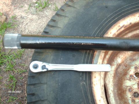 1990 Ford F-150 - Axle shaft and ratchet on a tire, dated 04/19/2007.