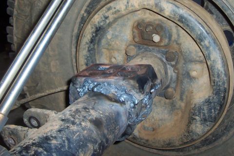 1994 Ford F-150 - Close-up of a welded rear axle component, showing the brake drum and suspension linkage.