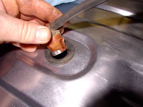 1986 Ford Bronco - The vent valve going back in. Be sure to install the rubber grommet first and then the valve.
