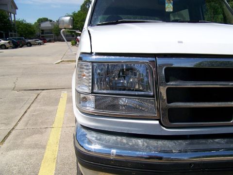 1995 Ford Bronco - Close-up of the front grille and headlights on a 1995 Ford Bronco.