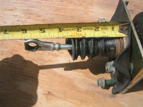 1973 Ford F-100 - Measuring a brake master cylinder. The tape measure shows it is approximately 6 inches long.