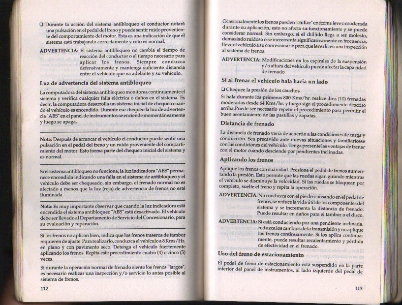 Spanish-language Ford owner's manual pages on anti-lock brakes, ABS warning light and parking brake