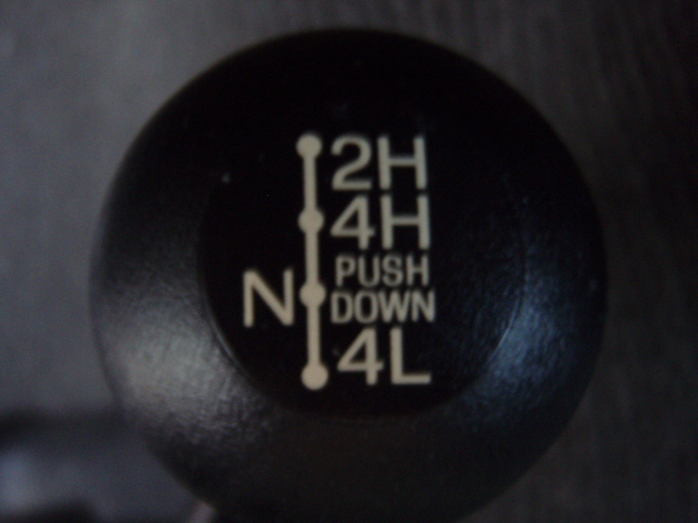 Transfer case shifter with 2H, 4H, N, PUSH DOWN, 4L markings