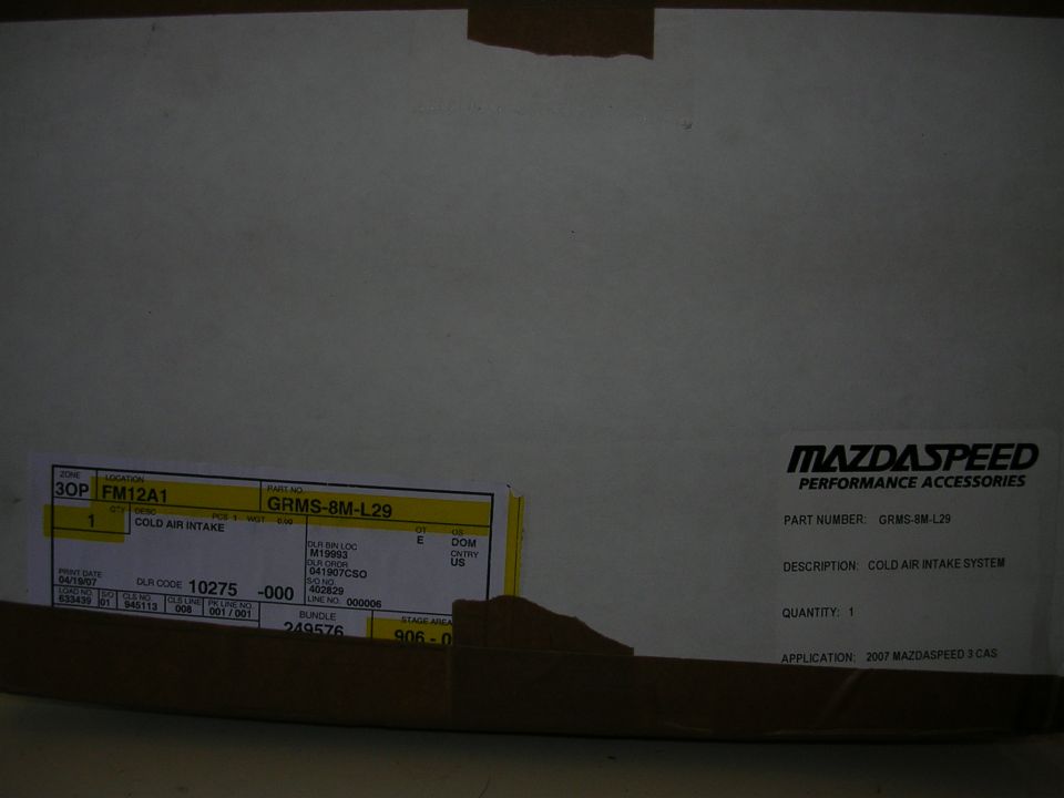 Mazdaspeed cold air intake box with labels showing part number GRMS-8M-L29 and application 2007 Mazdaspeed 3
