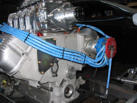 1964 Ford 427 - Engine with supercharger and blue spark plug wires.