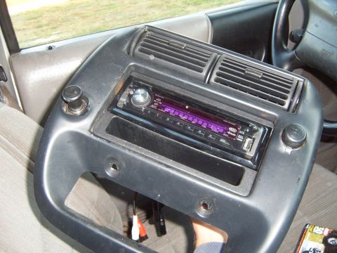 1997 Ford Ranger - Interior view of a 1997 Ford Ranger dashboard, showing the center console with an aftermarket stereo installed.