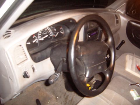 1997 Ford Ranger - Interior view of a 1997 Ford Ranger, focusing on the dashboard and steering wheel.