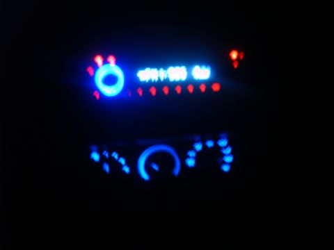 1997 Ford Ranger - A vehicle's dashboard interior is illuminated by blue LED lights on the gauges and digital display.