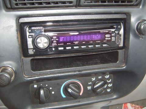 1997 Ford Ranger - Close-up of a car's interior, showing the stereo and climate control knobs.