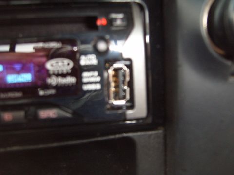 1997 Ford Ranger - Close-up of a car stereo a USB port and a digital display.