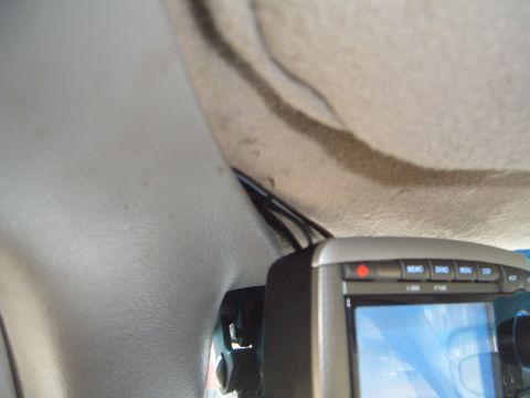 1997 Ford Ranger - A GPS device is mounted inside a vehicle, with wiring running along the headliner.