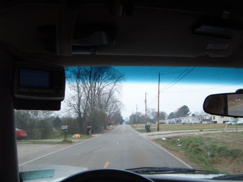 1997 Ford Ranger - View from inside a vehicle shows an aftermarket stereo unit mounted to the dashboard.