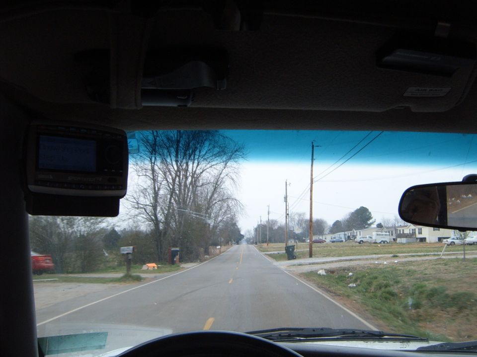 Aftermarket stereo mounted on the interior dashboard of a vehicle