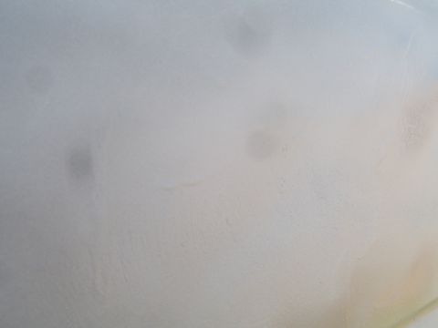 1988 Ford Bronco - Faded paint texture with water spots visible, SUPERMOTORS.NET watermark in lower right.