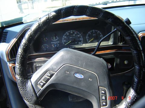 1988 Ford Bronco - The interior of a 1988 Ford Bronco, showing the dashboard, gauges, and steering wheel.